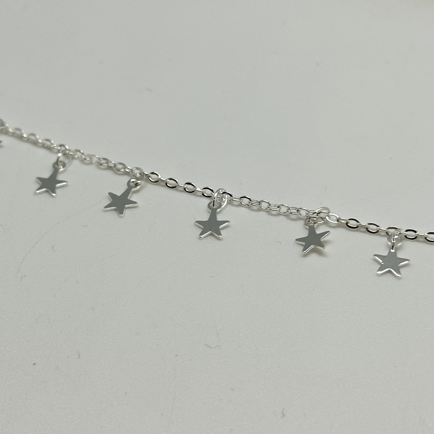 CP153 Cadena candado con estrellitas de 5 mm colgantes separadas por 10 mm Cadena por Metro Baño Plata