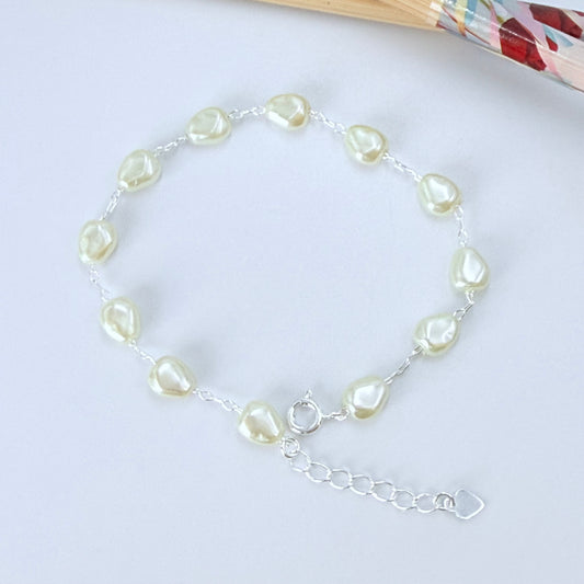 Joyas por Mayor Joyas Bañadas en Plata por Mayor Insumos para Joyas PP24 Pulsera Perla Gota tipo Perla de Río 8 x 6 mm Espesor 4 mm Largo 17.5 cm más extensor de 3 cm con terminal mini corazón Pulsera Baño Plata