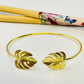 Joyas por Mayor Joyas Bañadas en Oro por Mayor Insumos para Joyas EO28 Esclava con Monstera en puntas 20 x 17 mm Diá. 65 mm espesor 1.5 mm Esclava Baño Oro