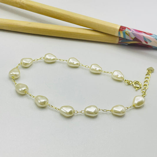 Joyas por Mayor Joyas Bañadas en Oro por Mayor Insumos para Joyas PO24 Pulsera Perla Gota tipo Perla de Río 8 x 6 mm Espesor 4 mm Largo 17.5 cm más extensor de 3 cm con terminal mini corazón Pulsera Baño Oro
