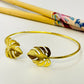 Joyas por Mayor Joyas Bañadas en Oro por Mayor Insumos para Joyas EO28 Esclava con Monstera en puntas 20 x 17 mm Diá. 65 mm espesor 1.5 mm Esclava Baño Oro