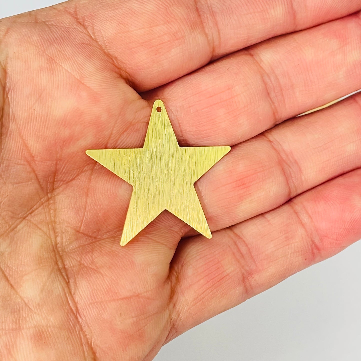 FO1277 Colgante Estrella Lijada 30 mm con perforación Espesor 0.6 mm Figura Baño Oro
