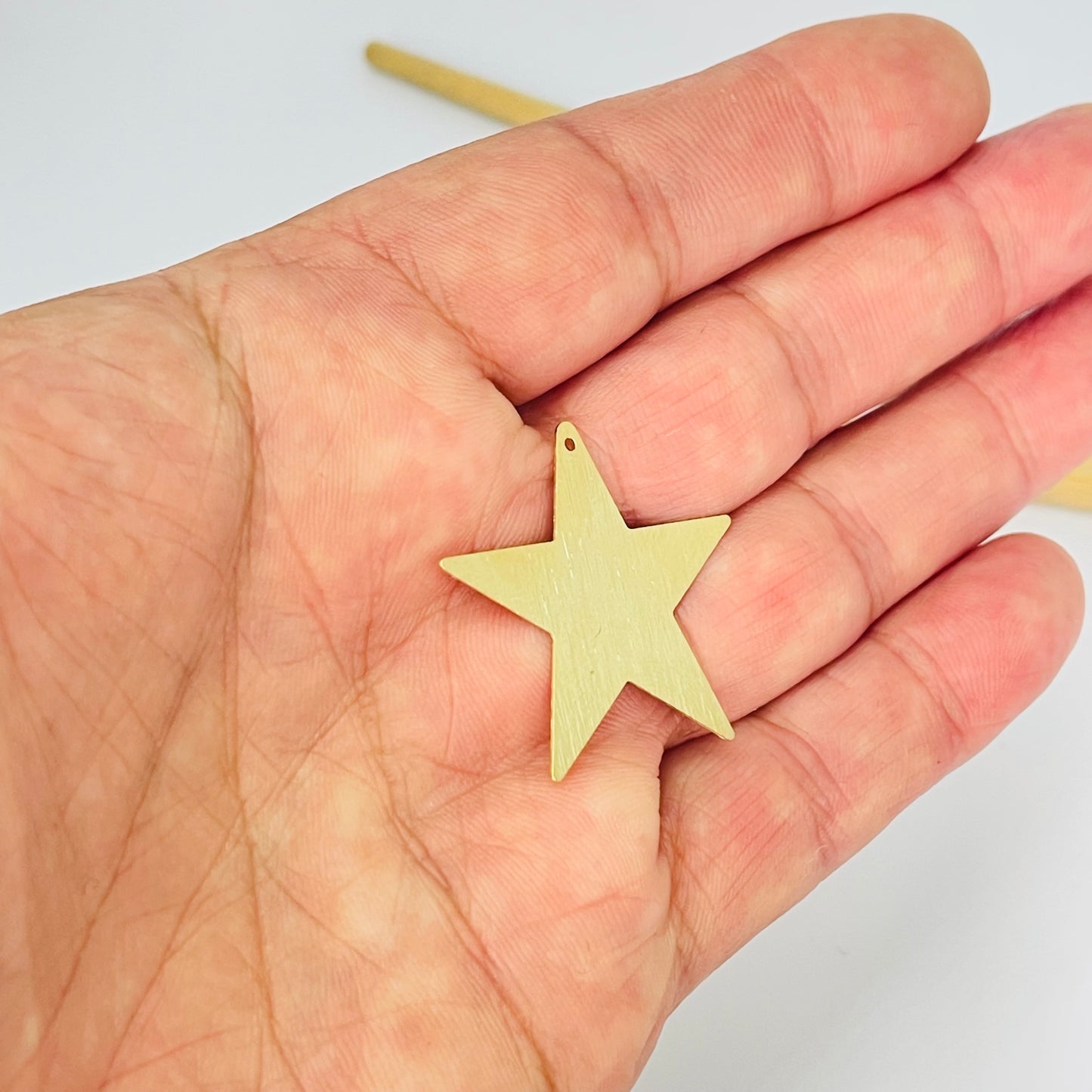 FO1277 Colgante Estrella Lijada 30 mm con perforación Espesor 0.6 mm Figura Baño Oro