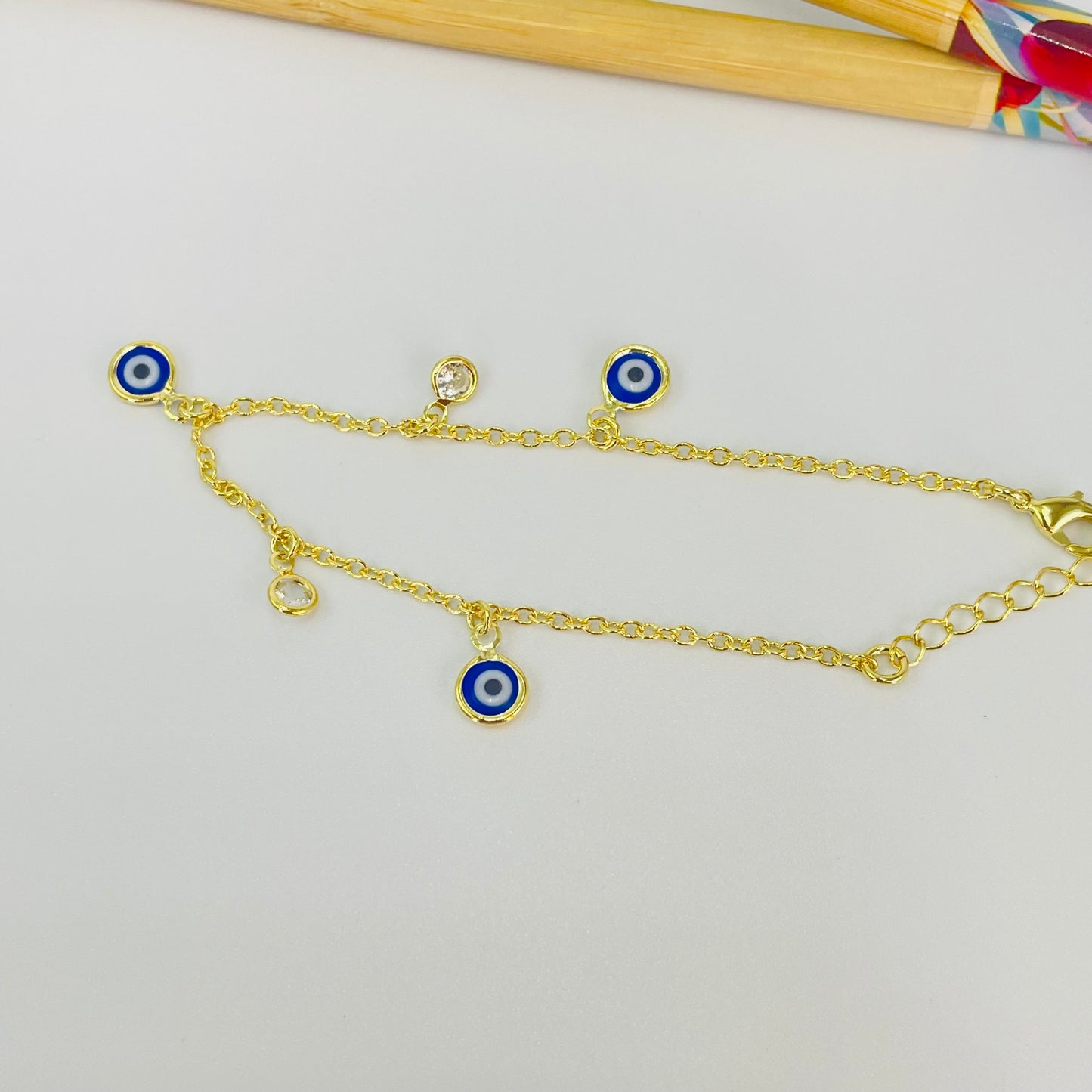 PO38 Pulsera Ojos Griegos diá. 6 mm y Puntos de Luz diá. 5 mm Cadena Candado Eslabón 2 mm Largo 16 cm más Extensor 5 cm Pulsera Baño Oro