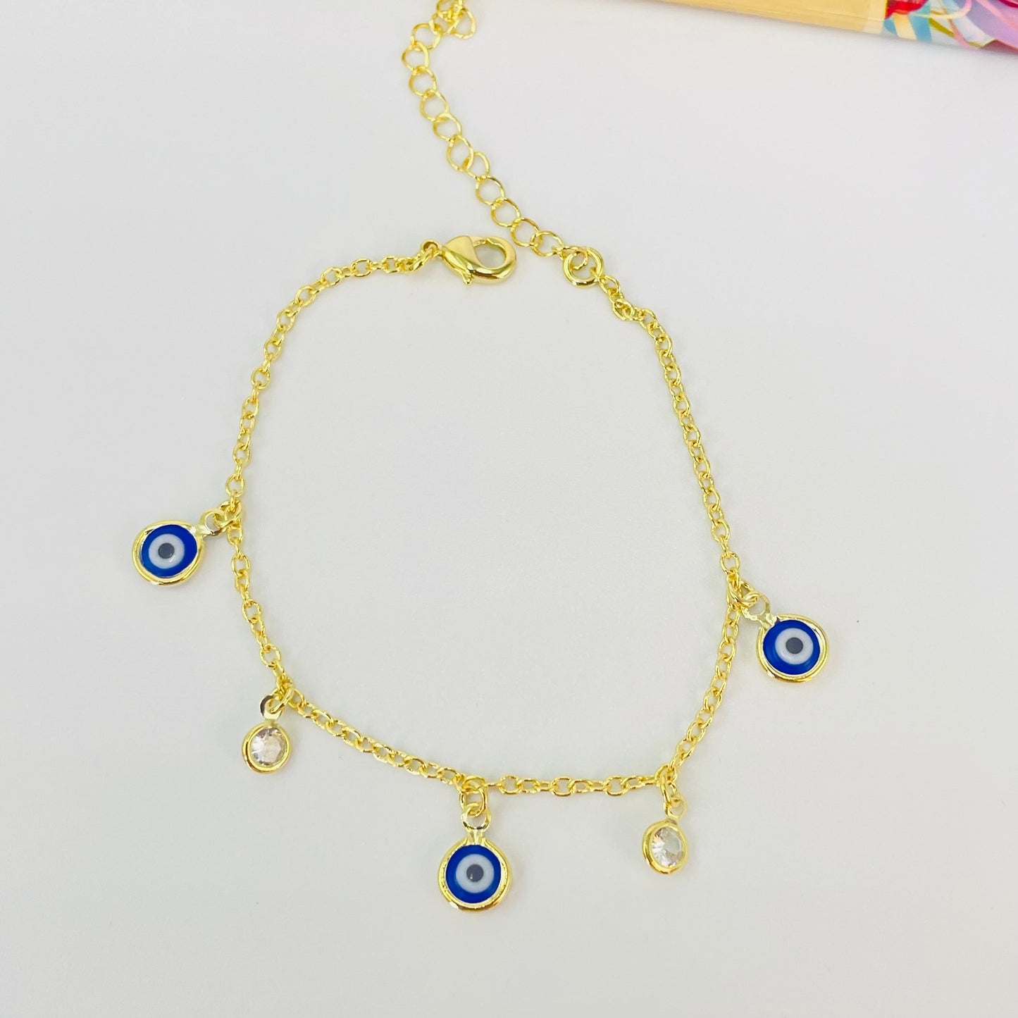 PO38 Pulsera Ojos Griegos diá. 6 mm y Puntos de Luz diá. 5 mm Cadena Candado Eslabón 2 mm Largo 16 cm más Extensor 5 cm Pulsera Baño Oro