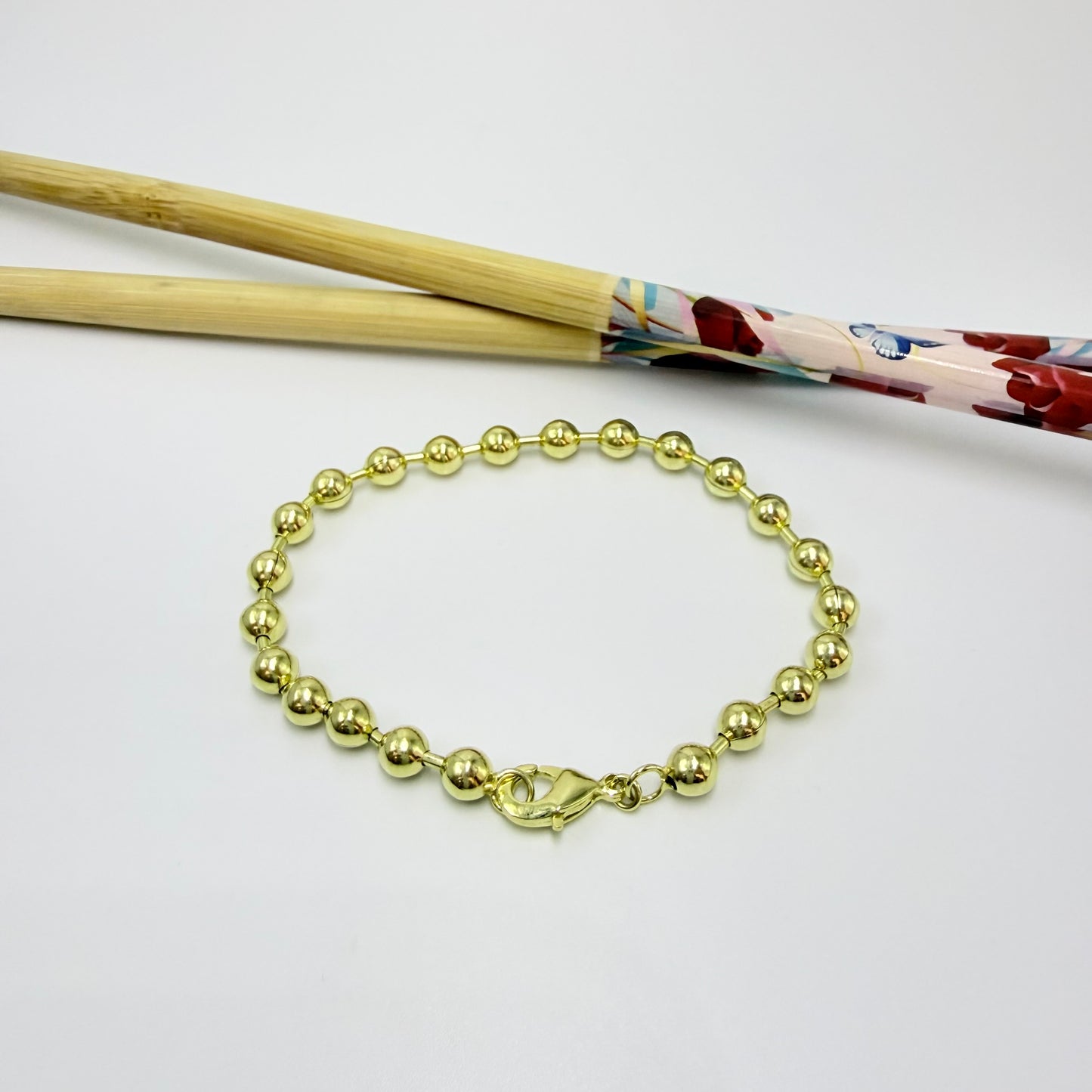 PO41 Pulsera Bolitas diá. 5 mm y Tubitos 1.2 mm Largo Total 18 cm Pulsera Baño Oro