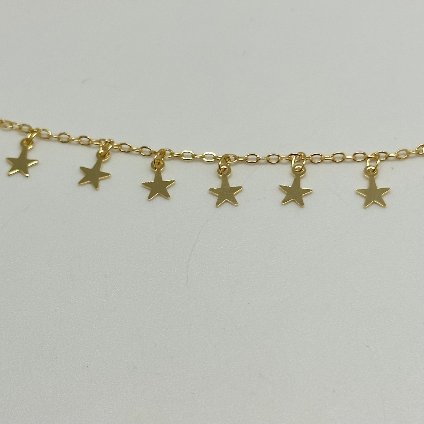 CO153 Cadena candado con estrellitas de 5 mm colgantes separadas por 10 mm Cadena por Metro Baño Oro