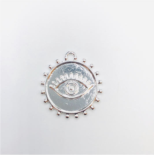 FP631 Colgante Redondo Ojo Griego con Borde 25 mm Figura Baño Plata Figuras Bañadas en Oro y Plata hecho de Bronce Bañado en Plata 50 ml