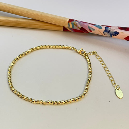 PO09 Pulsera Bolitas 2x2.5 mm Largo 17 cm mas extensor Pulsera Baño Oro