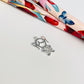 FP914 Colgante Niñita con circones 15x12 mm más argollita Figura Baño Plata